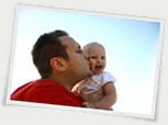 dad kissing baby